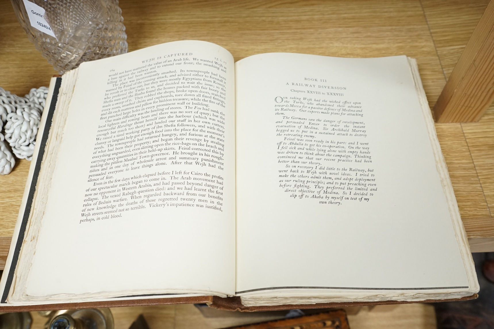 Lawrence, T.E. - Seven Pillars of Wisdom: a triumph. First Trade Edition. portrait frontis., num. portrait plates, 4 folded maps (outline colour) and some text illus.; original gilt cloth, roy. 8vo. 1935.